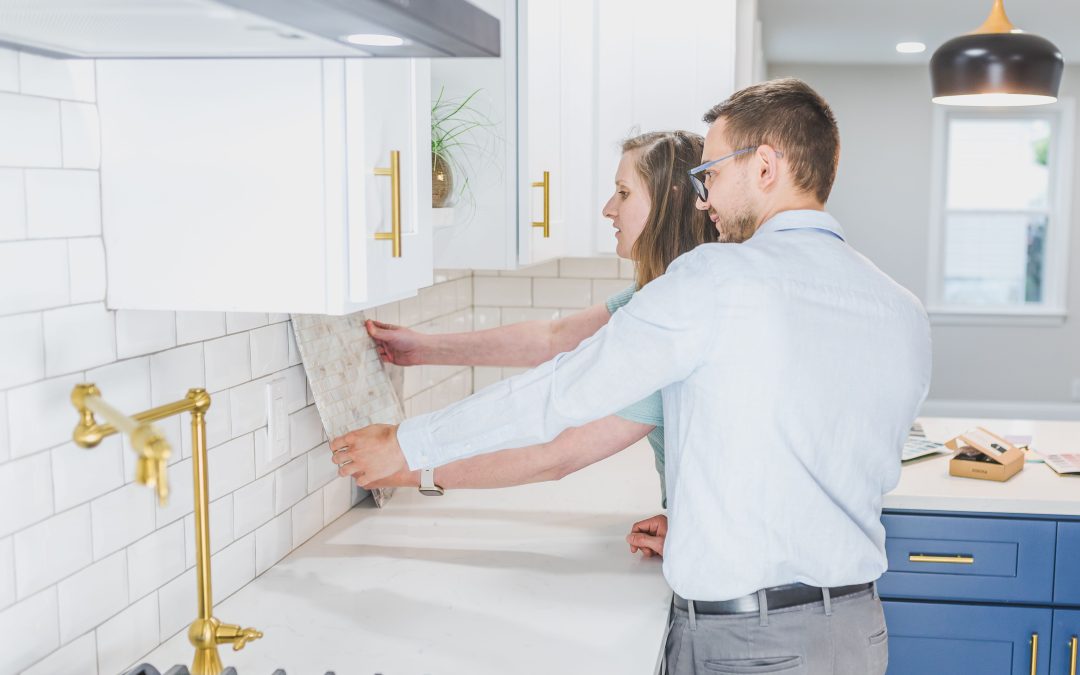 A couple comparing quotes and materials for their kitchen renovation.
